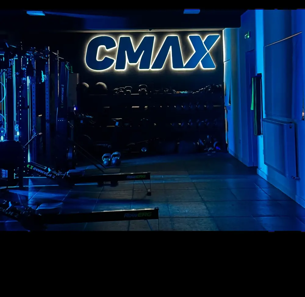The lit CMAX sign inside the HUB on King Street